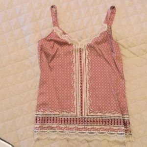 Tank size small. White House black market.